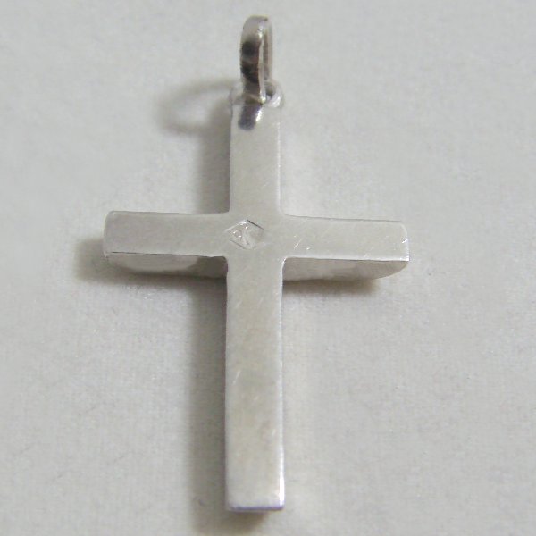 (p1135)Solid silver cross with bombe tips.